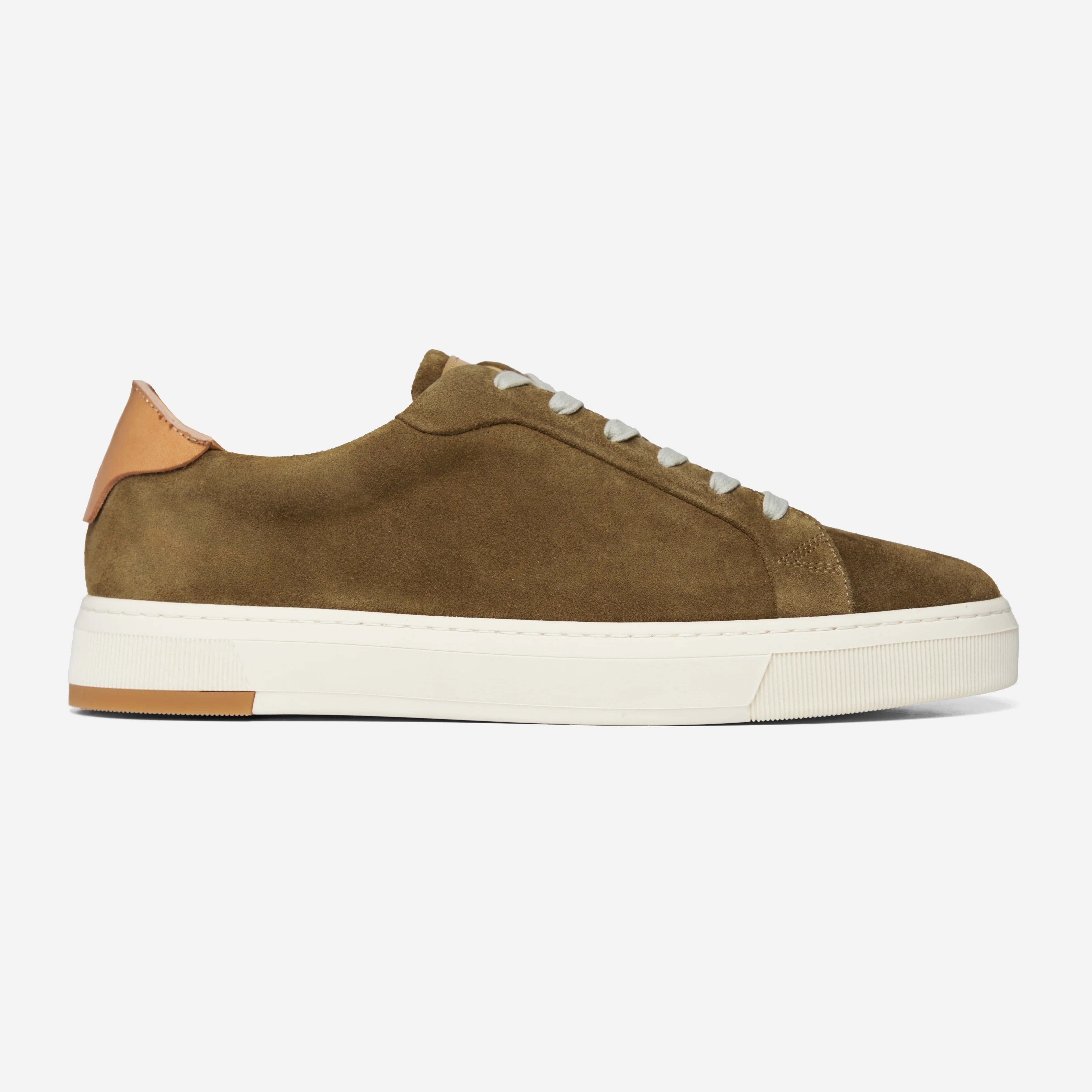 Brown suede sneaker with white laces on a light gray background